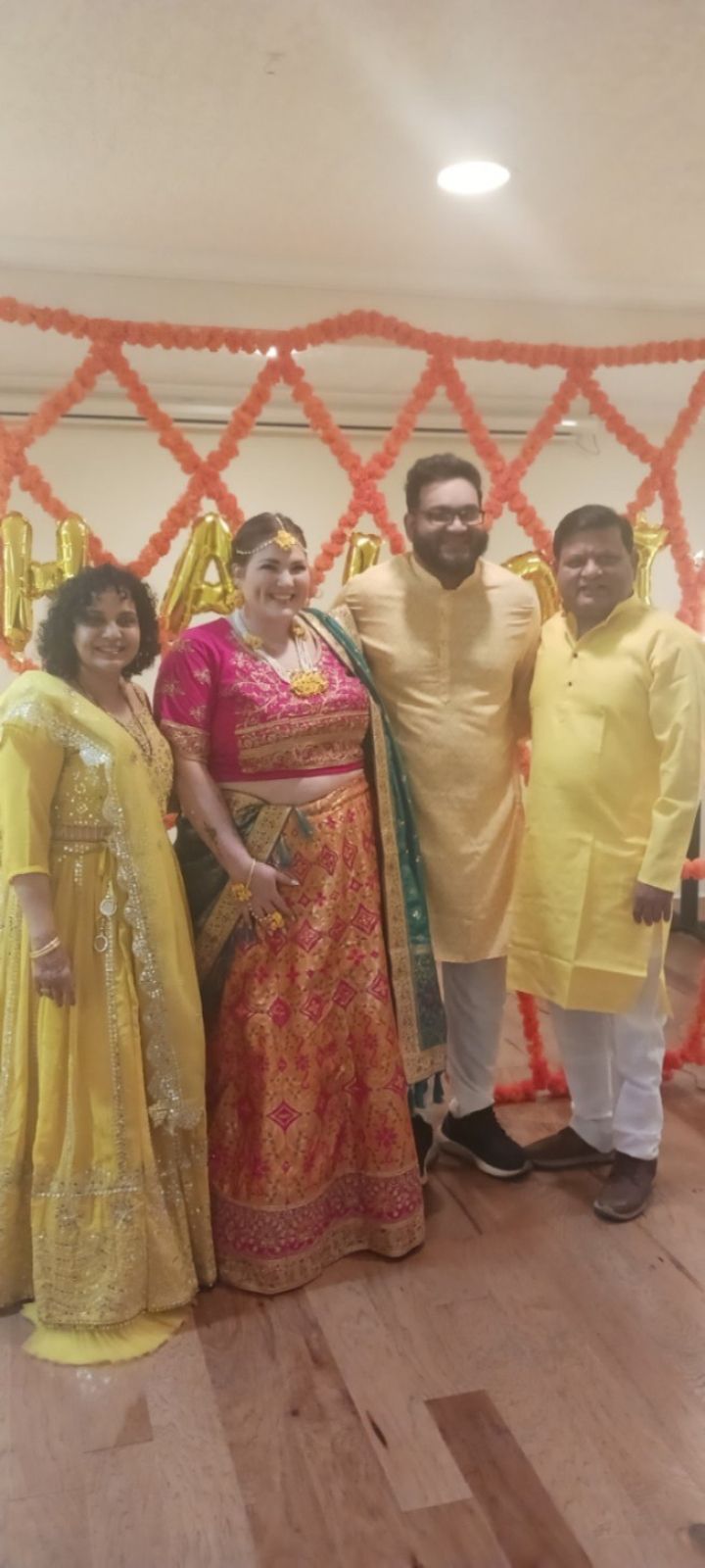 A group of people are posing for a picture in a room.