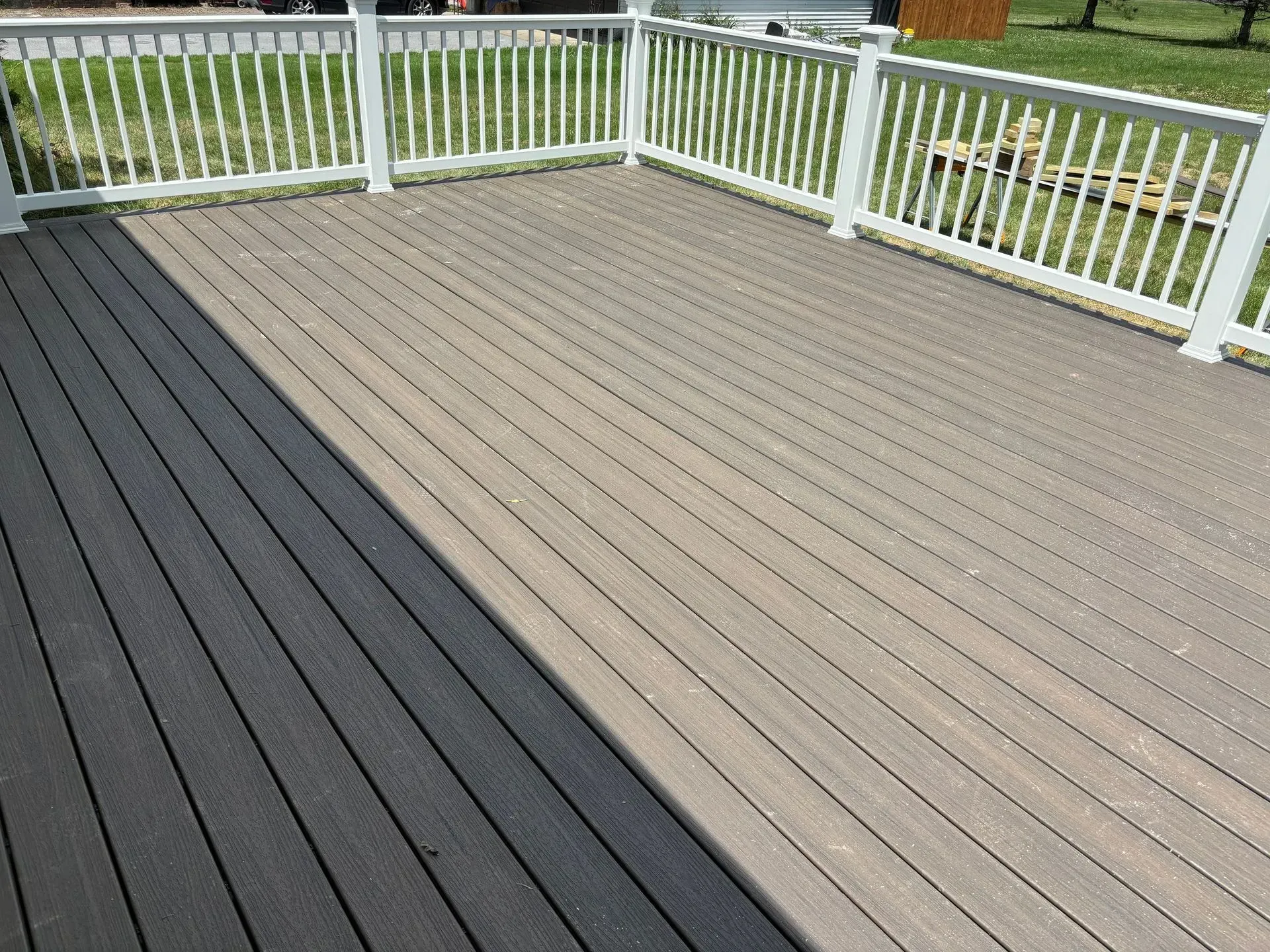 A black and white deck with a white railing