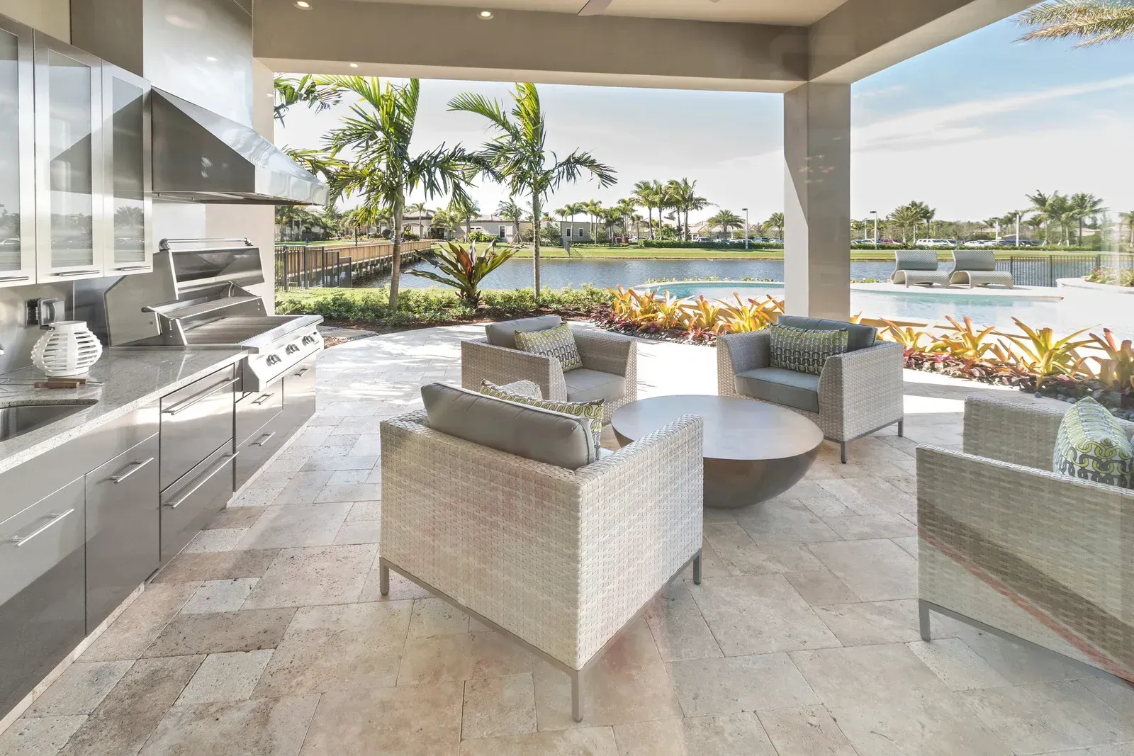 A kitchen and patio area with chairs and a table