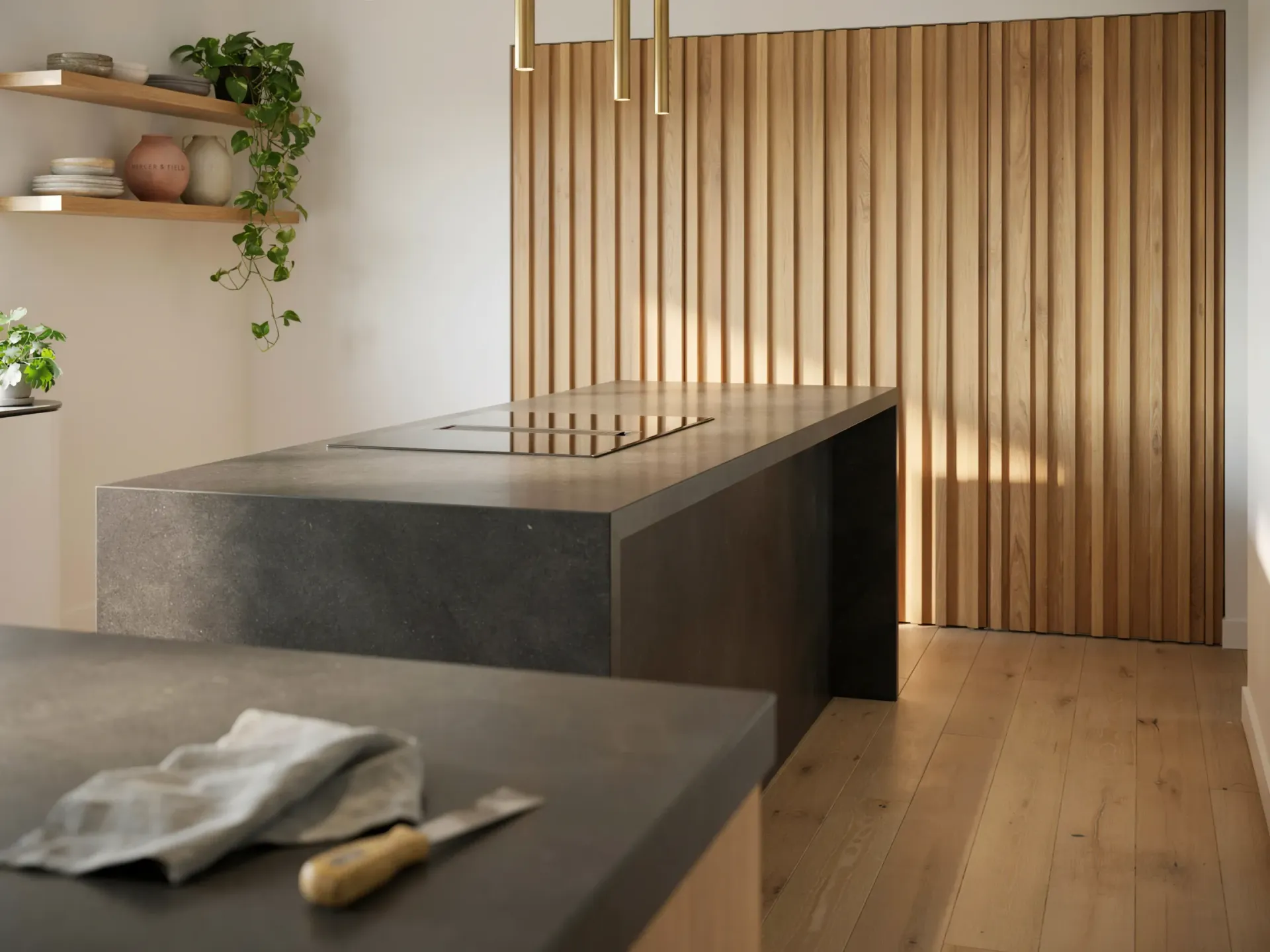 Modern minimalist kitchen with wood slat wall, concrete island, and light wood flooring