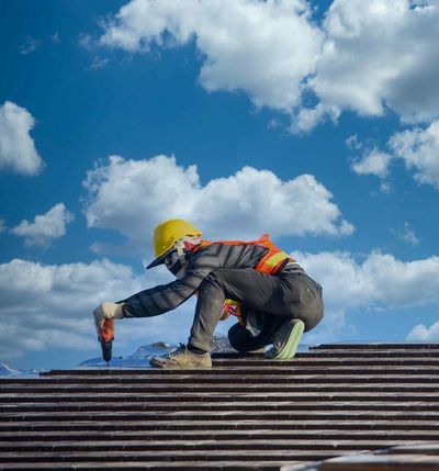 roofer installing roof tiles