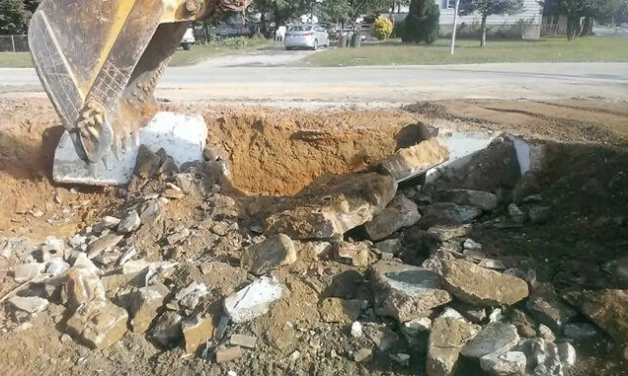 A bulldozer is digging a hole in the ground