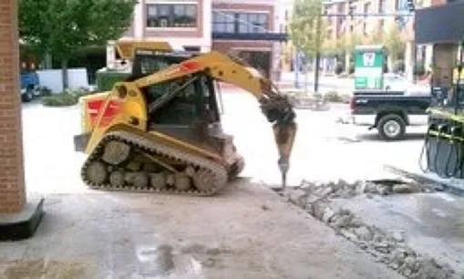 A bulldozer is digging a hole in the ground.