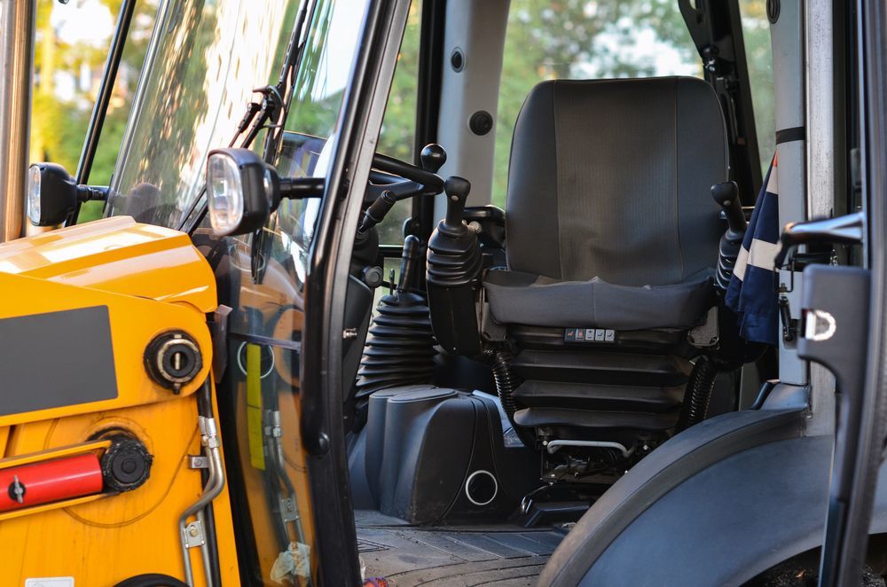 The Inside of a Yellow Tractor With the Letter D on the Door — LJE MechanicaI Gilgandra, NSW