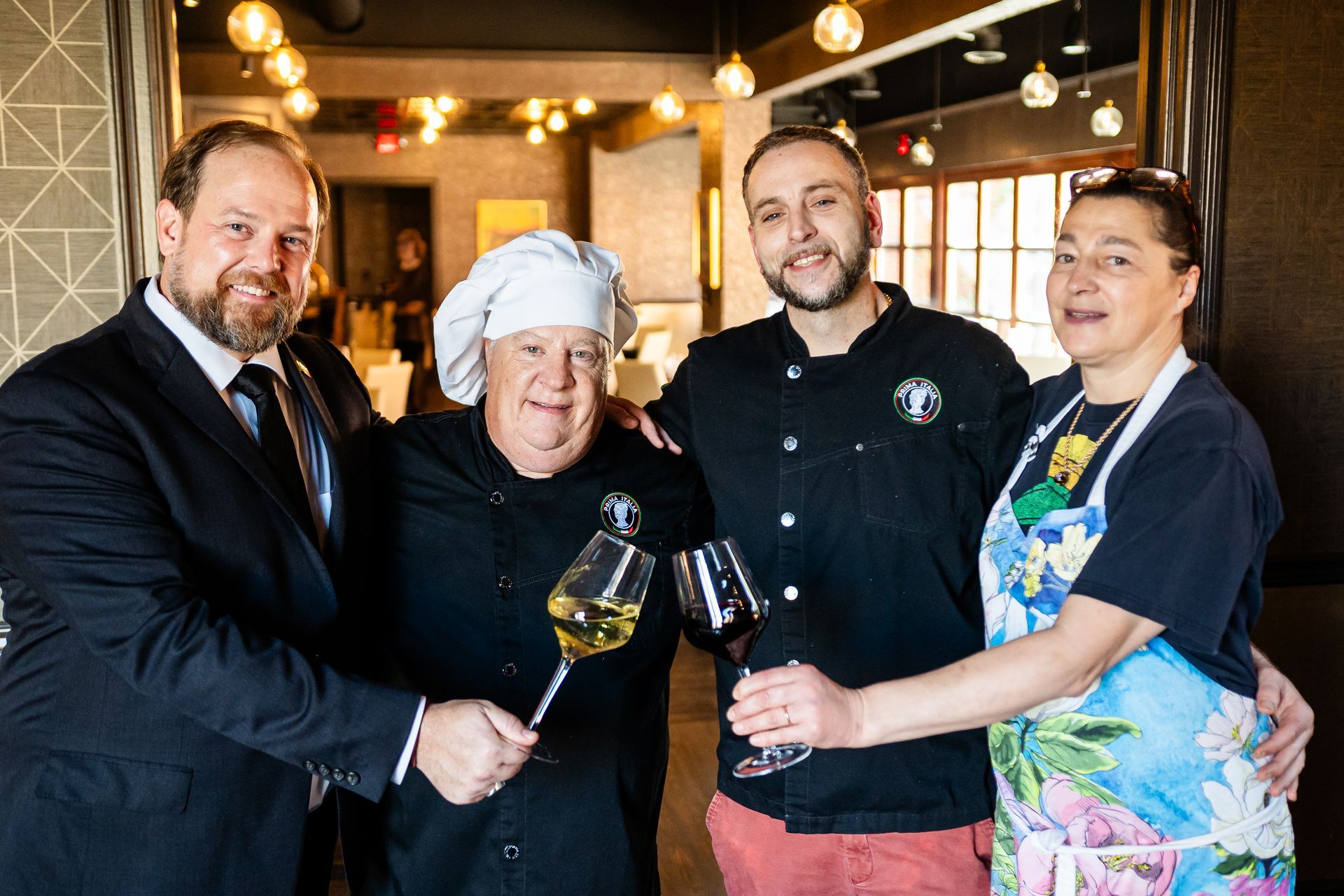 A group of people are posing for a picture in a restaurant.