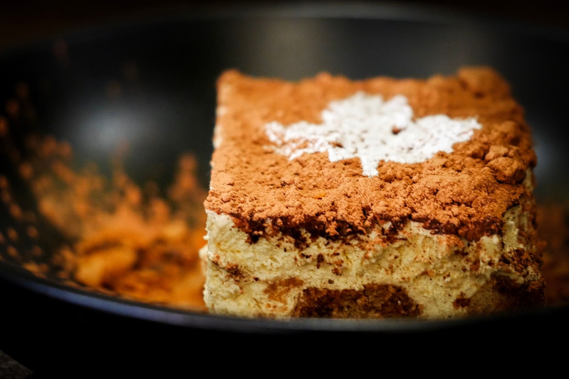 A close up of a piece of cake in a bowl.