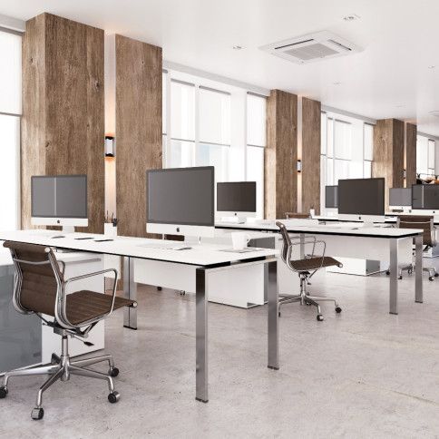 A large office with a lot of desks and chairs