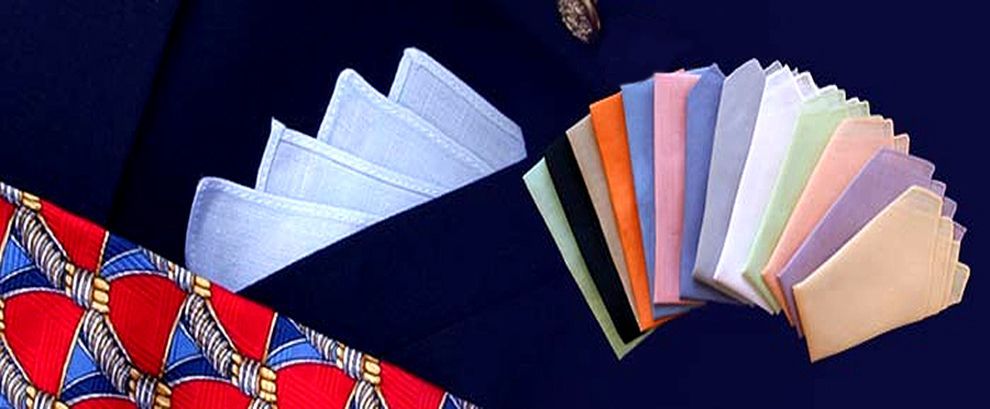 A bunch of different colored handkerchiefs on a table