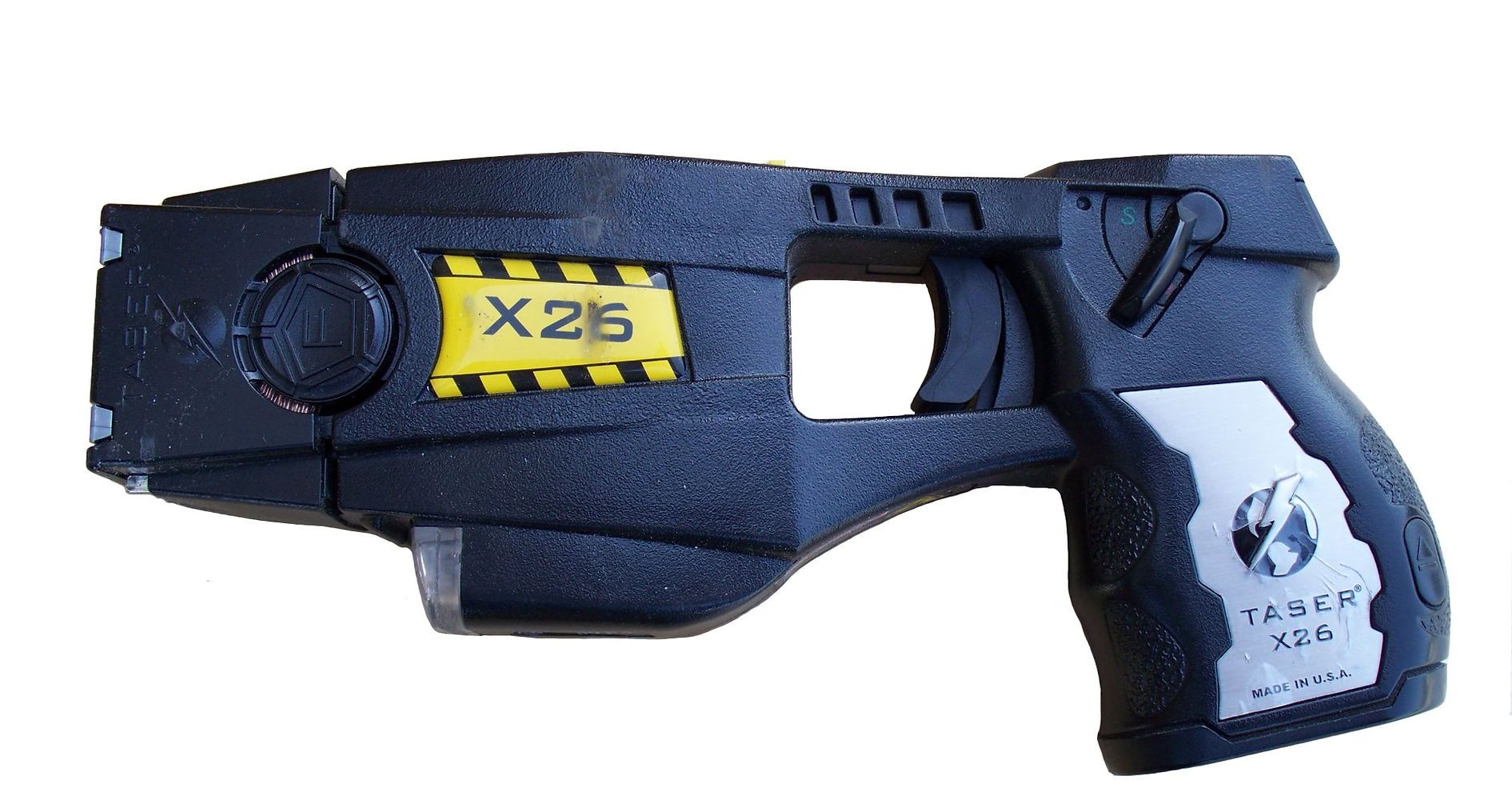 A black taser with a yellow sticker that says x216