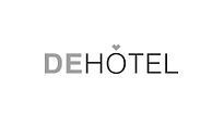 A black and white logo for a hotel with a heart in the middle.