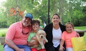 The dog named Cotton with the Kaleel family.