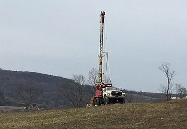 A water well drilling rig