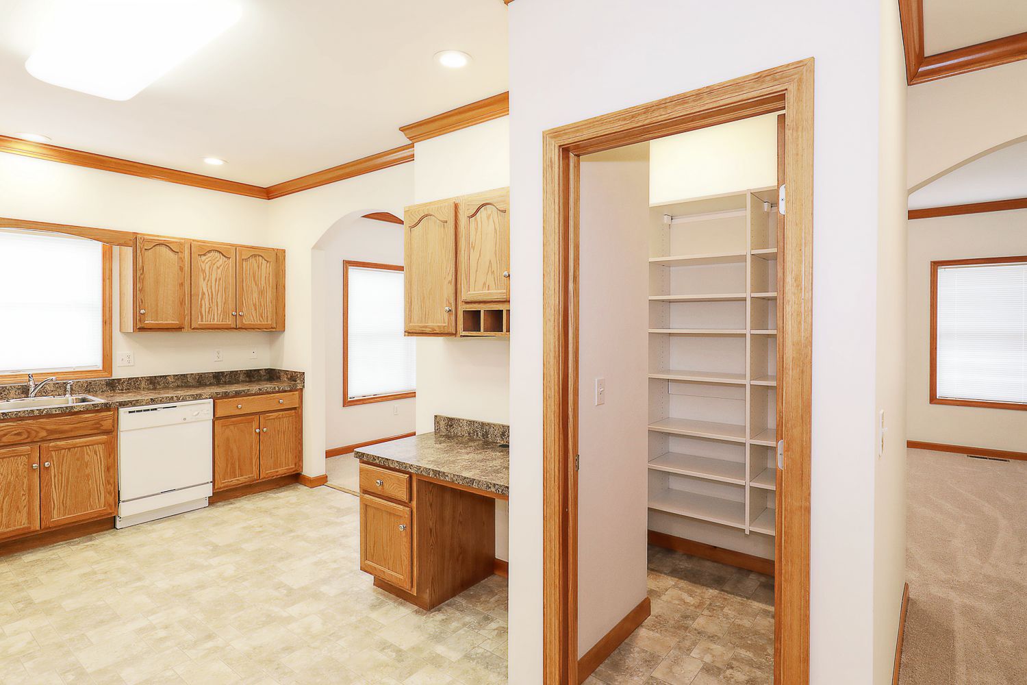 Photo showing kitchen with walk-in storage