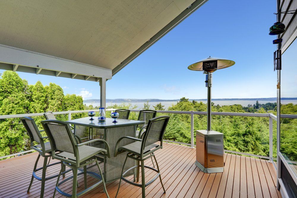 Patio Area With Table Walkout Deck Overlooking Scenic View — Builders in Ballina, NSW