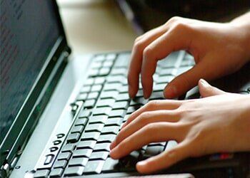 Hands Typing on Laptop Keyboard — IT Services in Corte Madera, CA