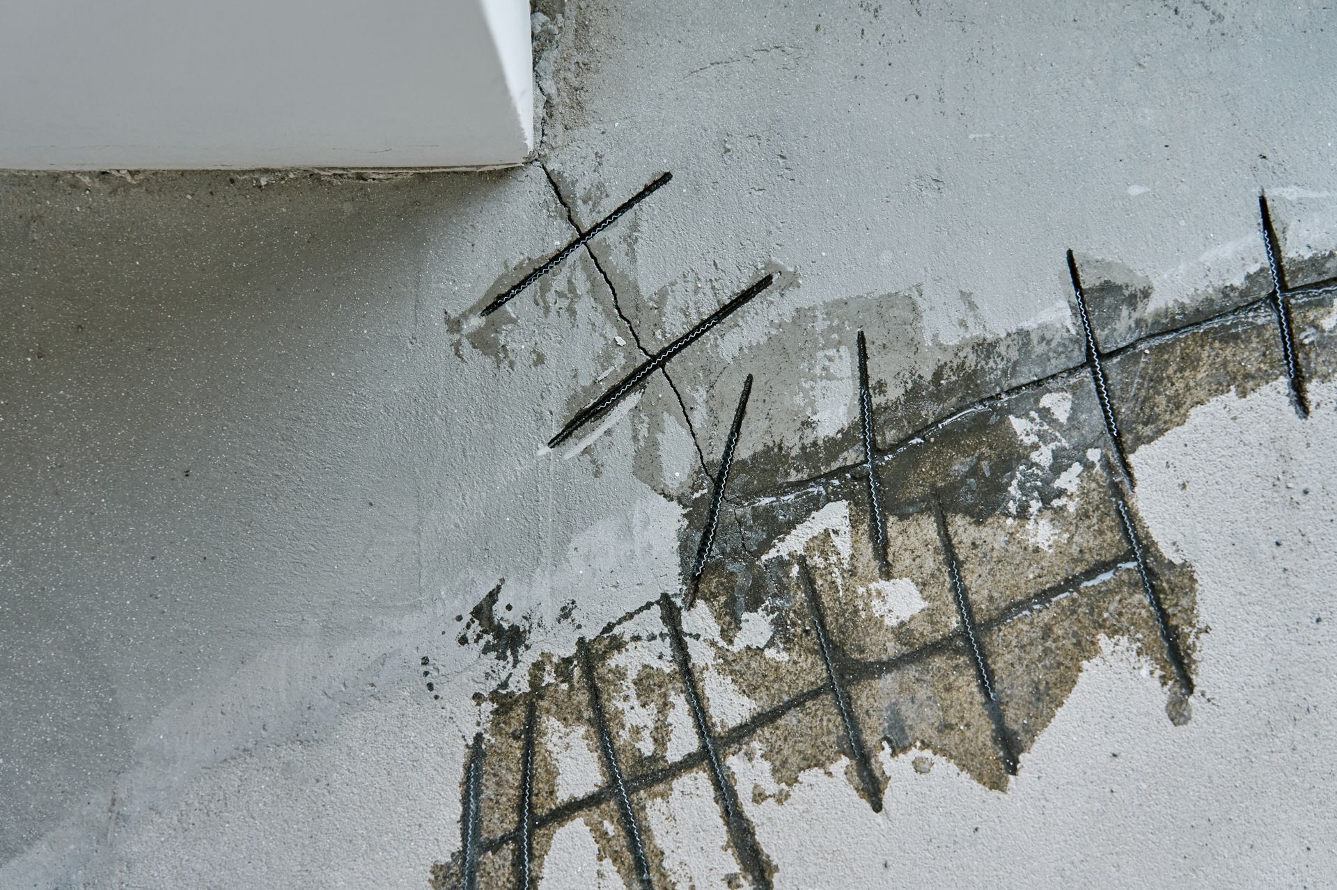 A concrete floor with a few holes in it