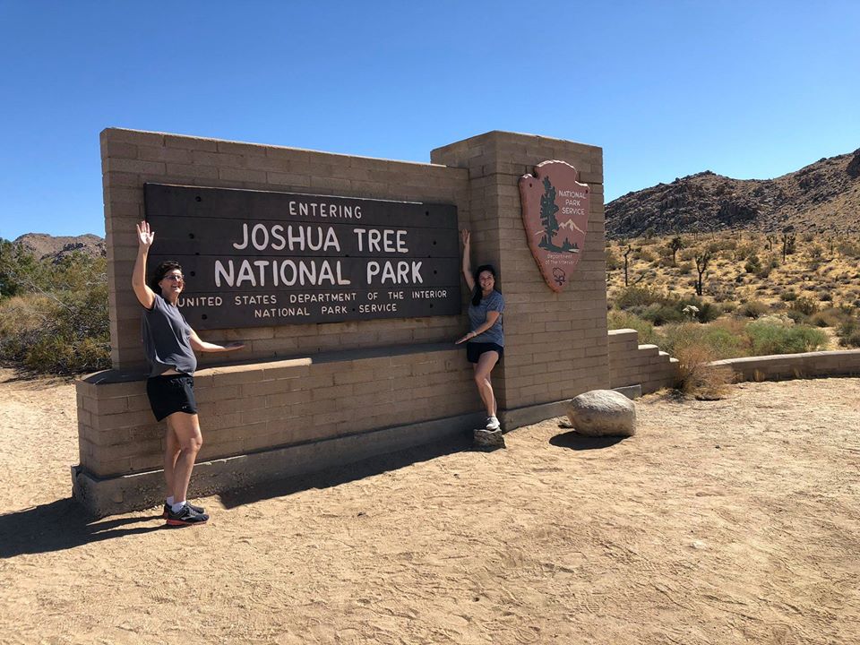 two people taking a picture in national joshua tree entrance