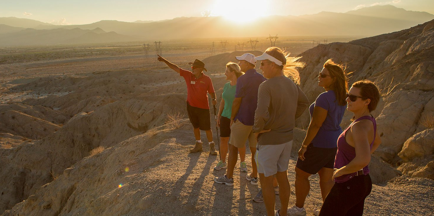 Image of group of people at the top of mountain