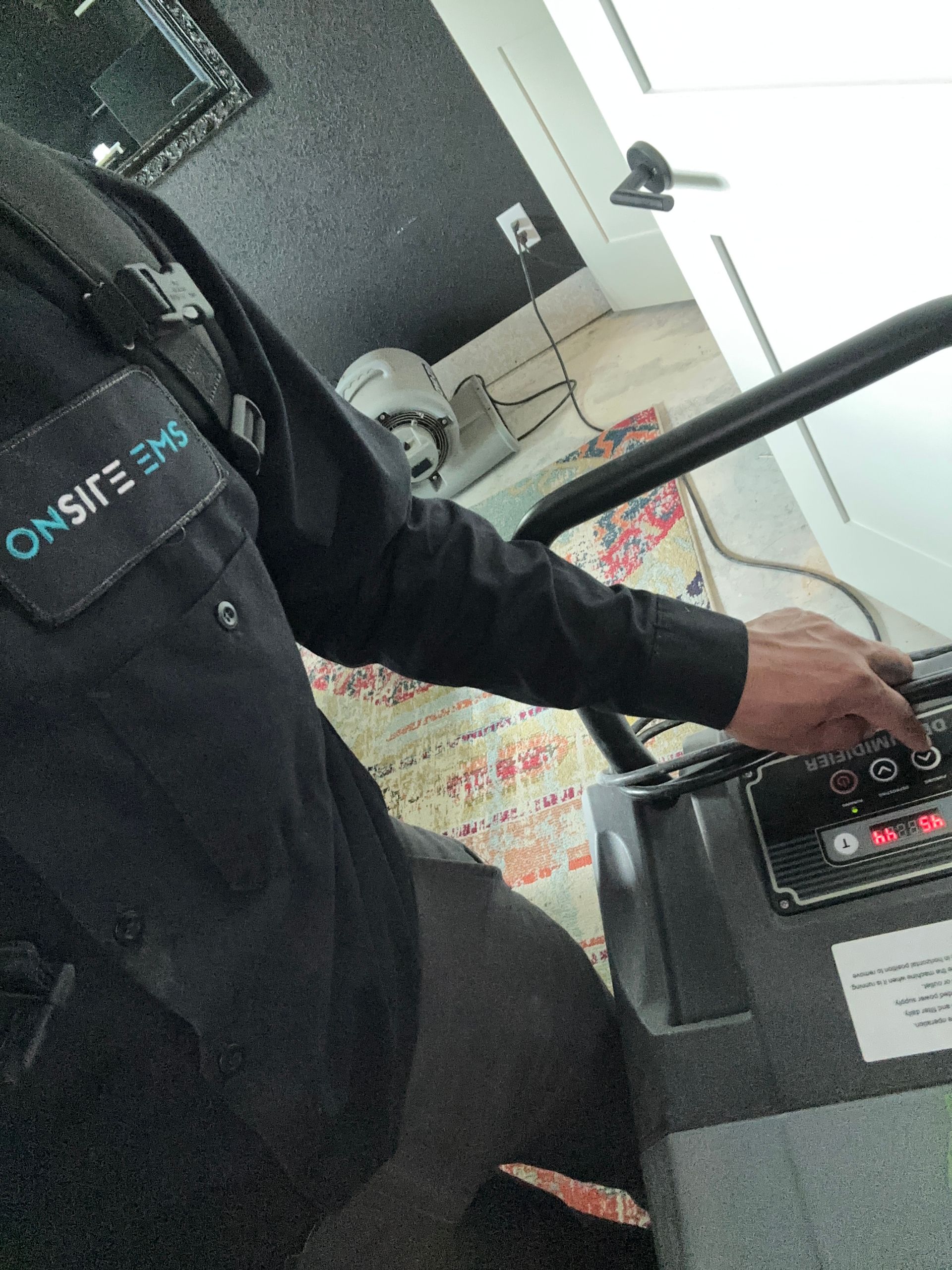 A man wearing a black shirt with the word onsafe on it