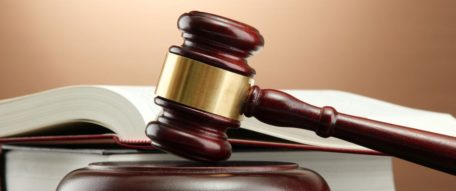 Gavel and law book used by solicitors in Canterbury  