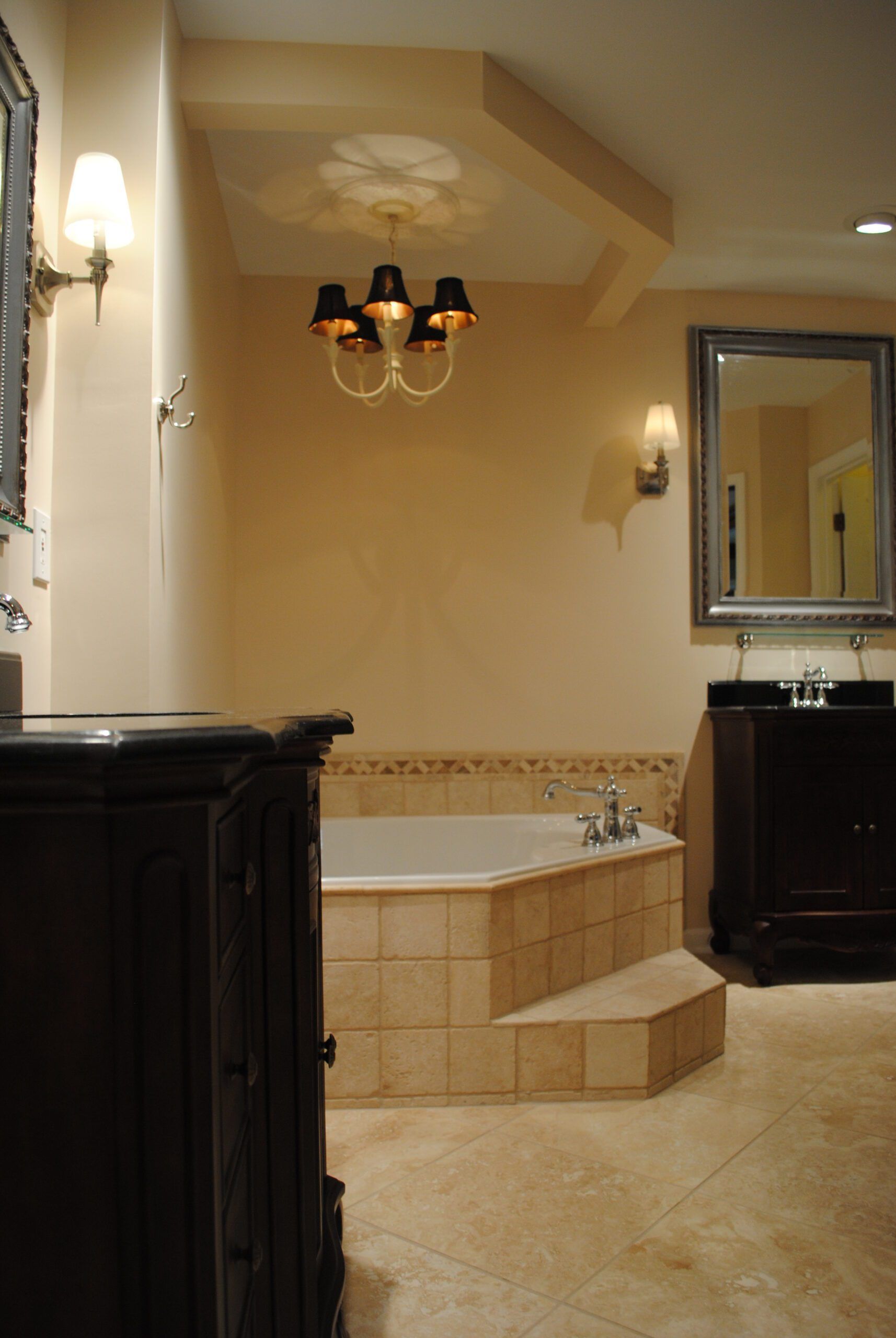 A bathroom with a large tub and a mirror