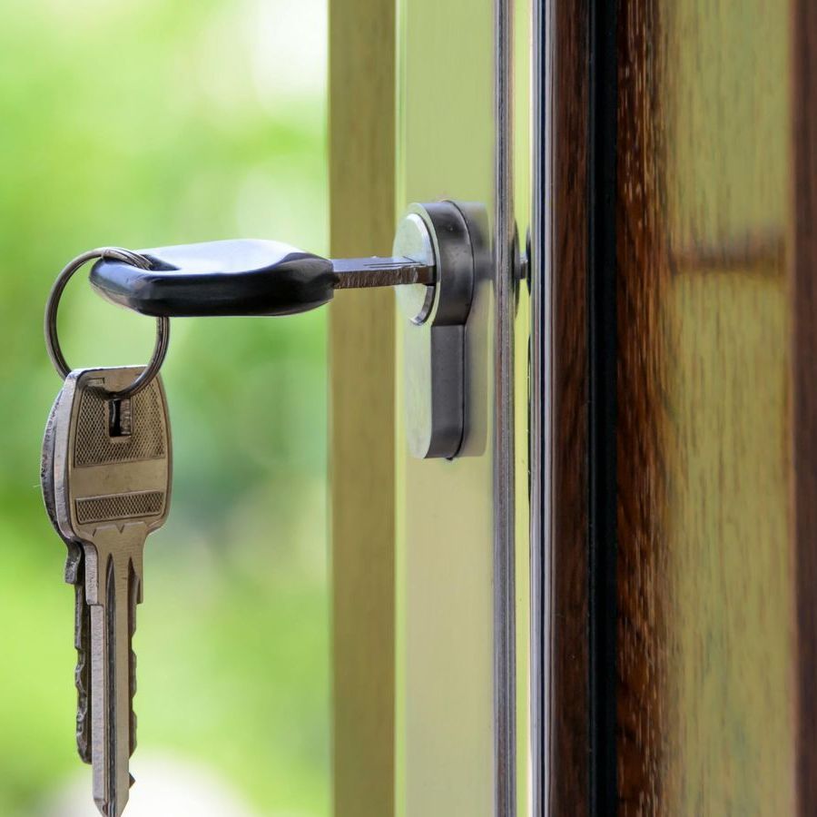 A close up of a key in a door lock