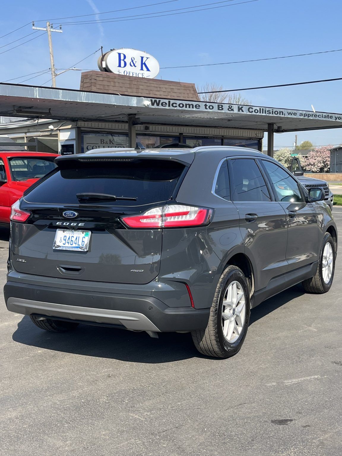 A ford edge is parked in a parking lot in front of a building. | B & K Collision