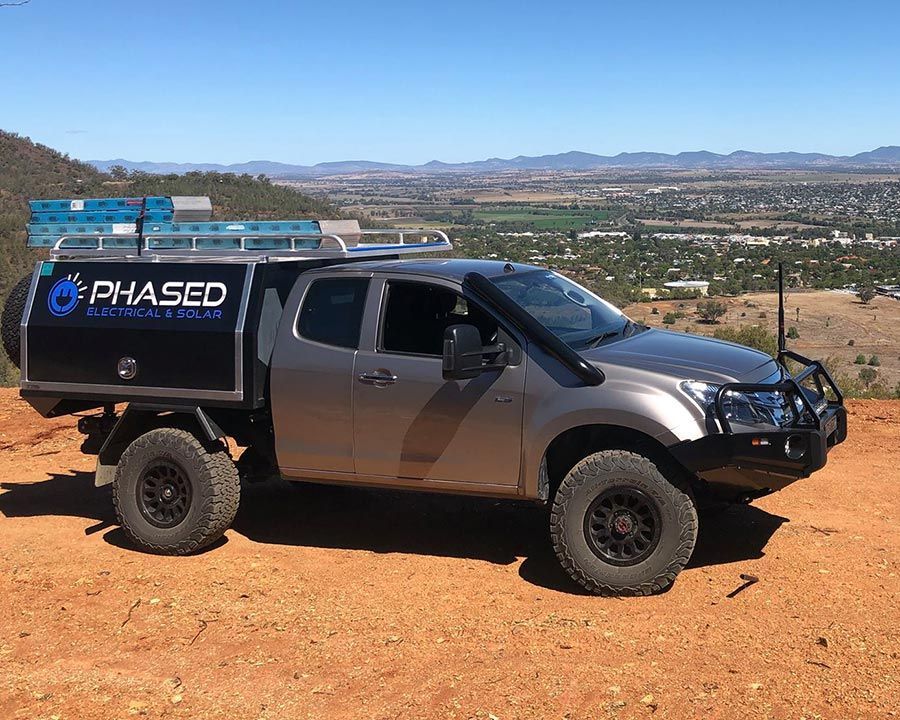 Grey Coloured Truck With Phased Logo Printed on It — Experienced Solar Installers in Tamworth