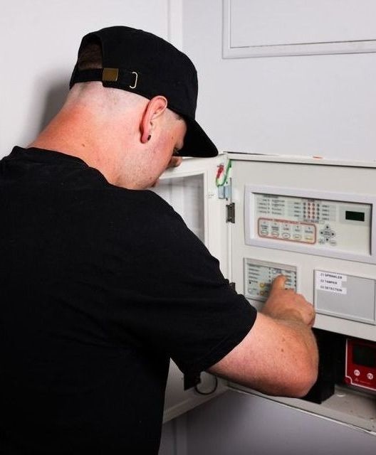 Man Fixing Alarm Systems
