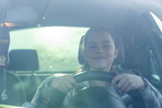 Young Girl Smiling While Driving — Leesburg, GA — DOCO Driving School