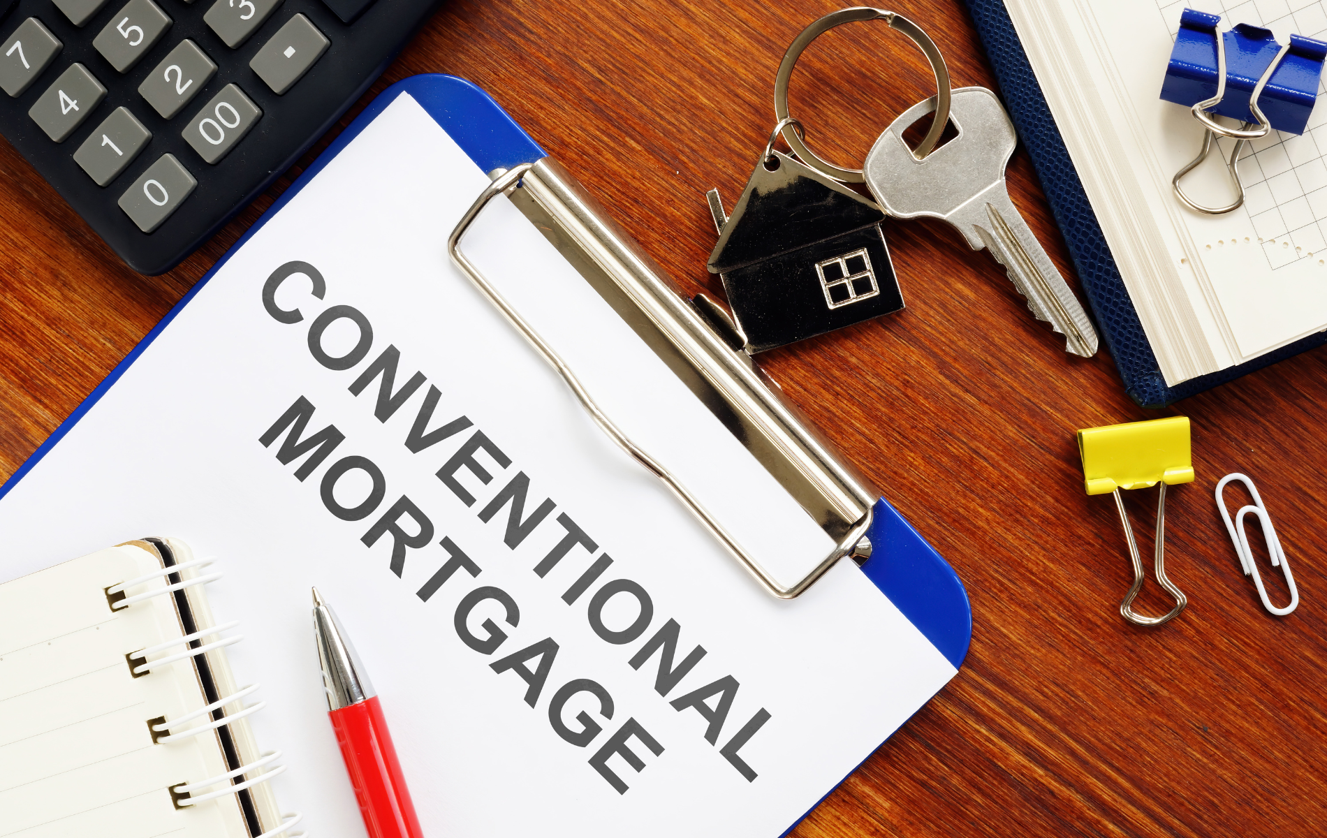 A clipboard with the words conventional mortgage written on it