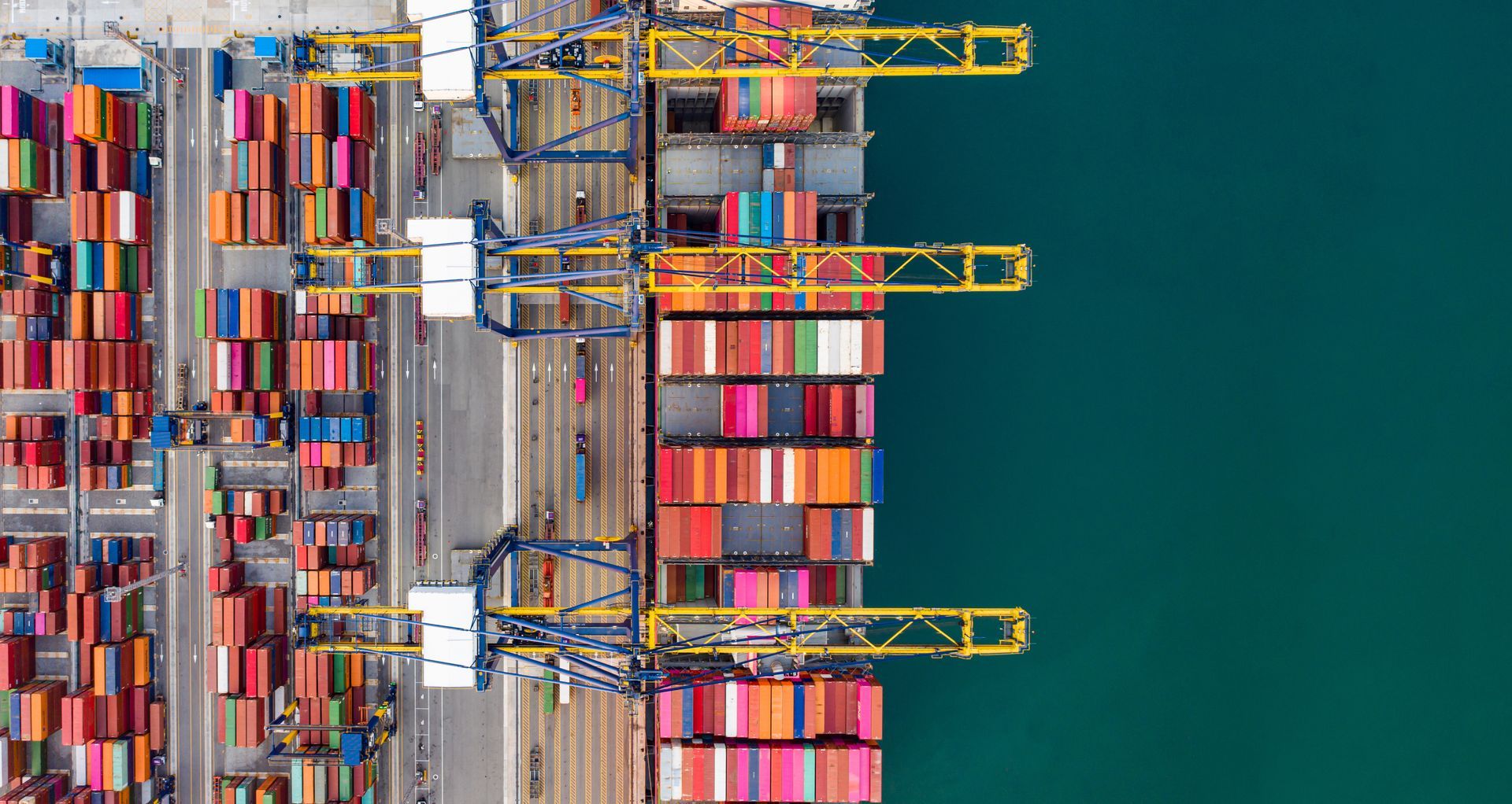 Aerial view of shipping containers and cranes