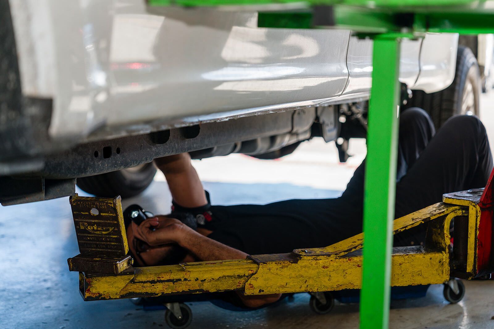 Mechanic Working on Under-Chassis | Red Lion Auto Repair