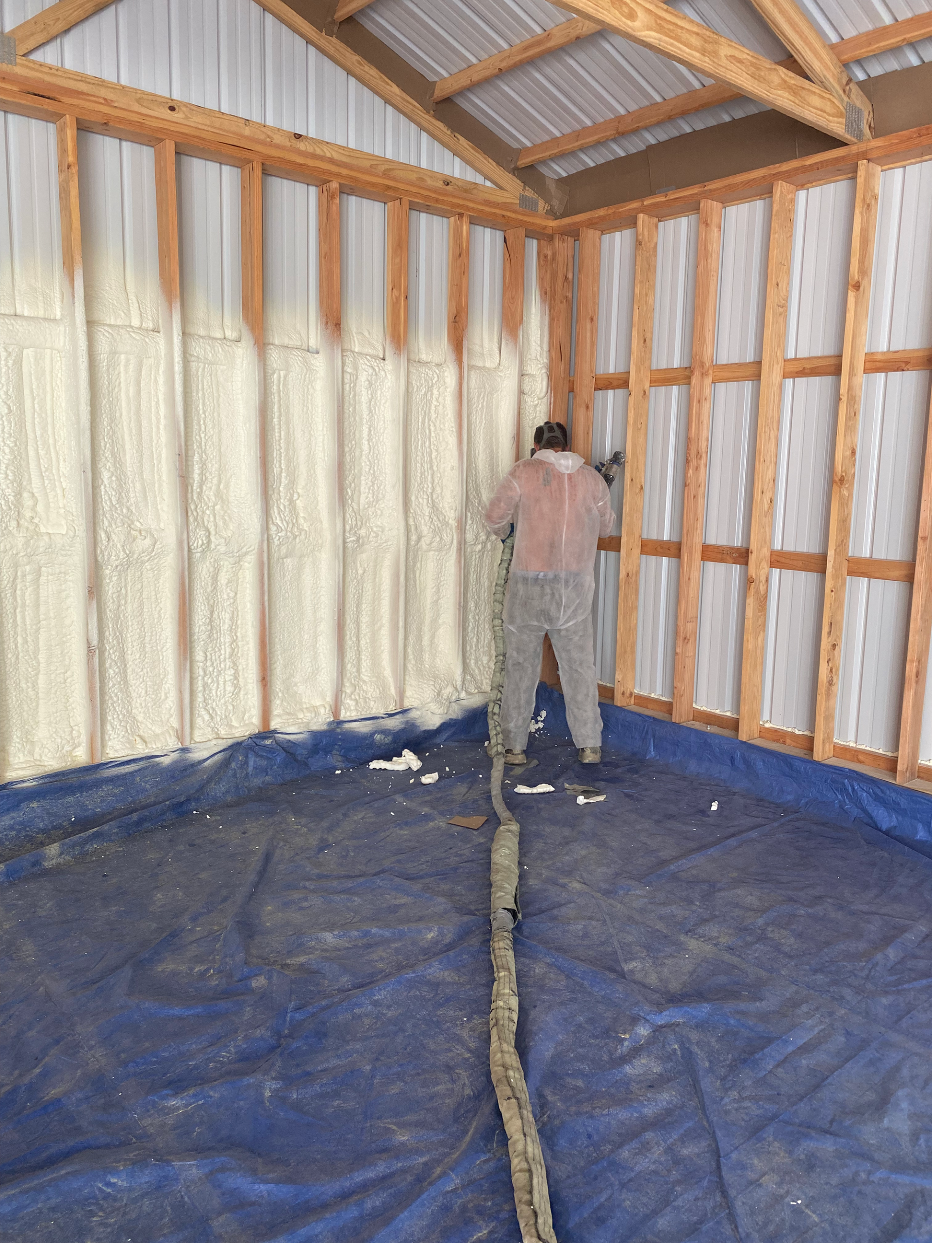 A DK Spray Foam & Insulation Technician Working on Spray Foam Insulation in a Mid-MO Building