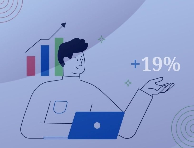 Uomo con computer portatile e grafico che mostra un aumento del +19%.