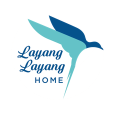 The logo for layang layang home shows a bird flying in the air.