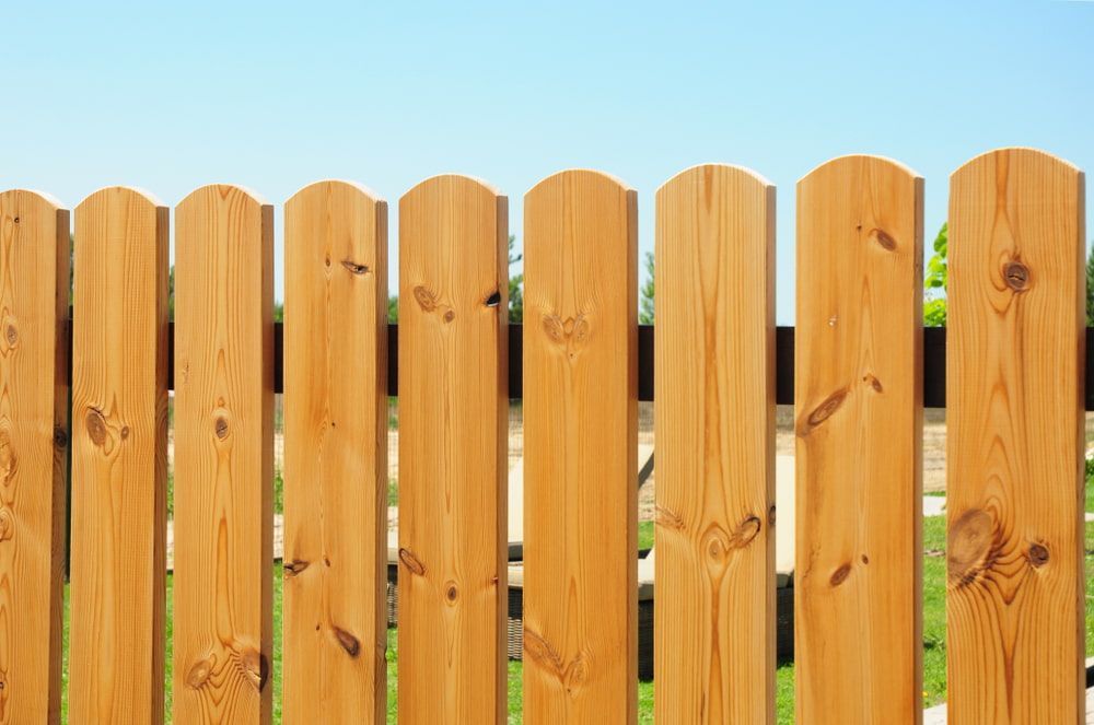 A Close up Of a Wooden Fence with A Blue Sky in The Background — Budget Timbers in Mullumbimby, NSW