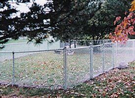 Chain Link Fencing — White Fence in Backyard in Dansville, MI