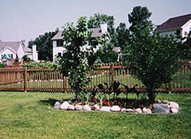 Wood Picket Fencing — Dark Brown Backyard Fencing in Dansville, MI