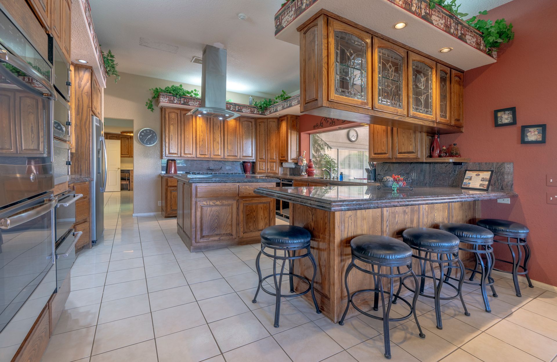 A vase of flowers is sitting on a table next to a window.