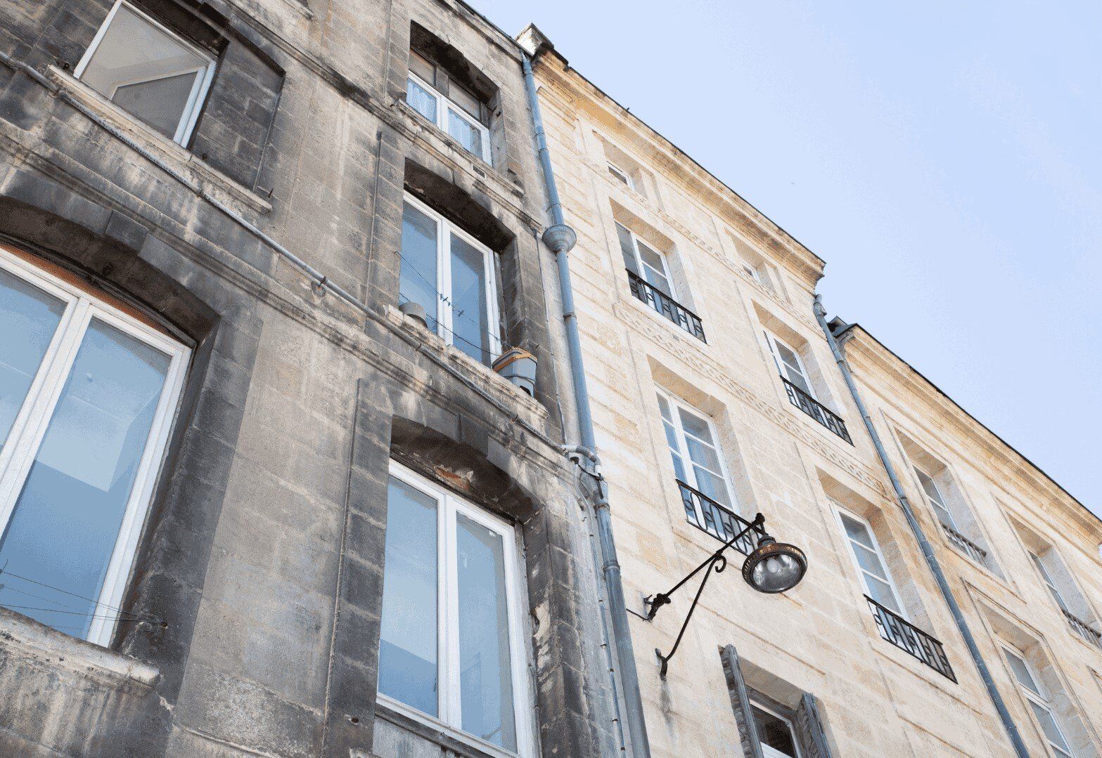 Wooden fence being pressure washed