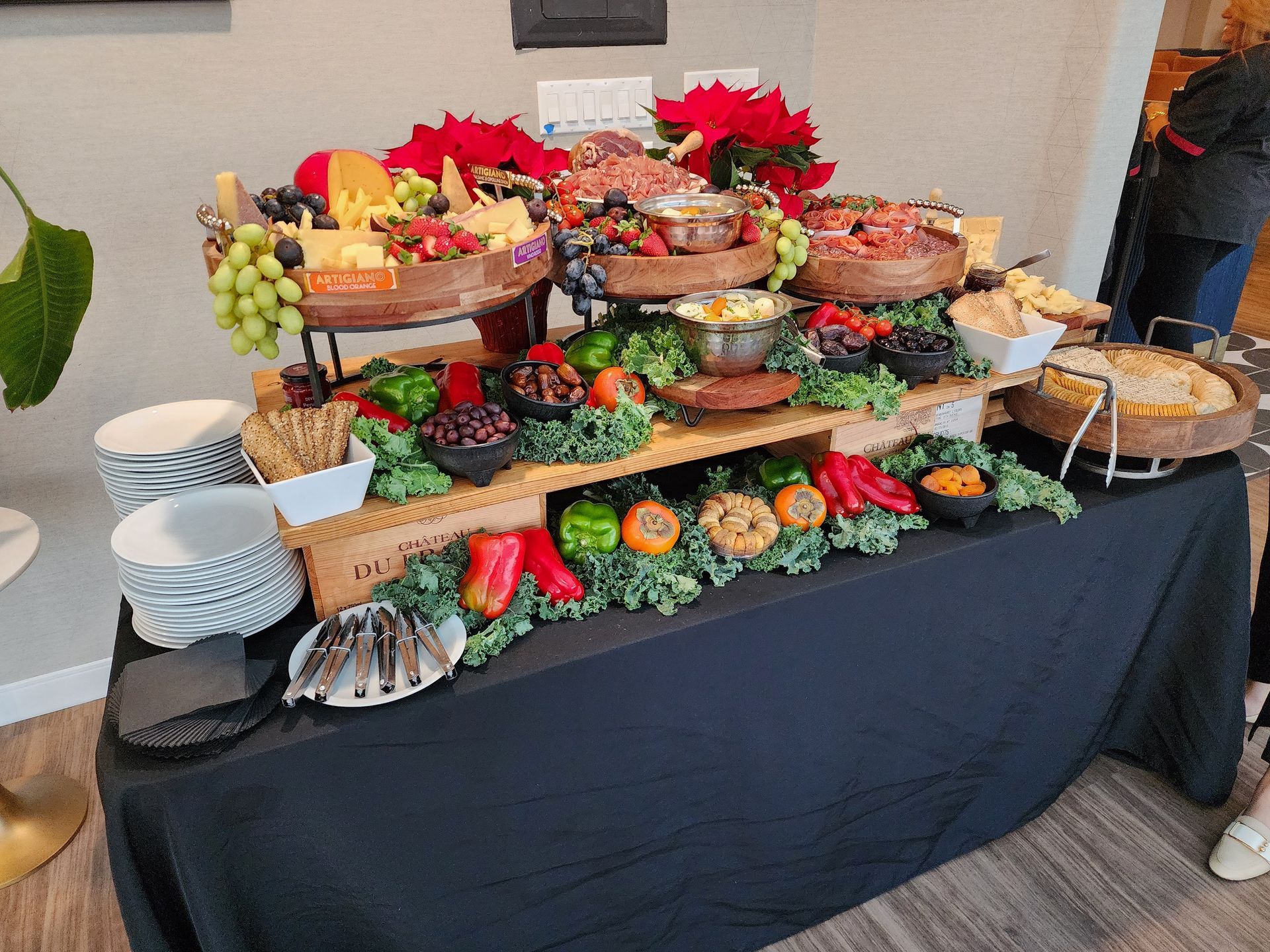 A buffet table filled with lots of food and vegetables.