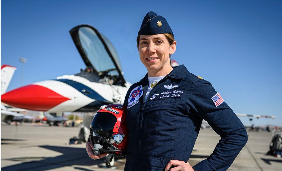 Michelle Curran of the US Air Force Thunderbirds with her F-16 fighter jet