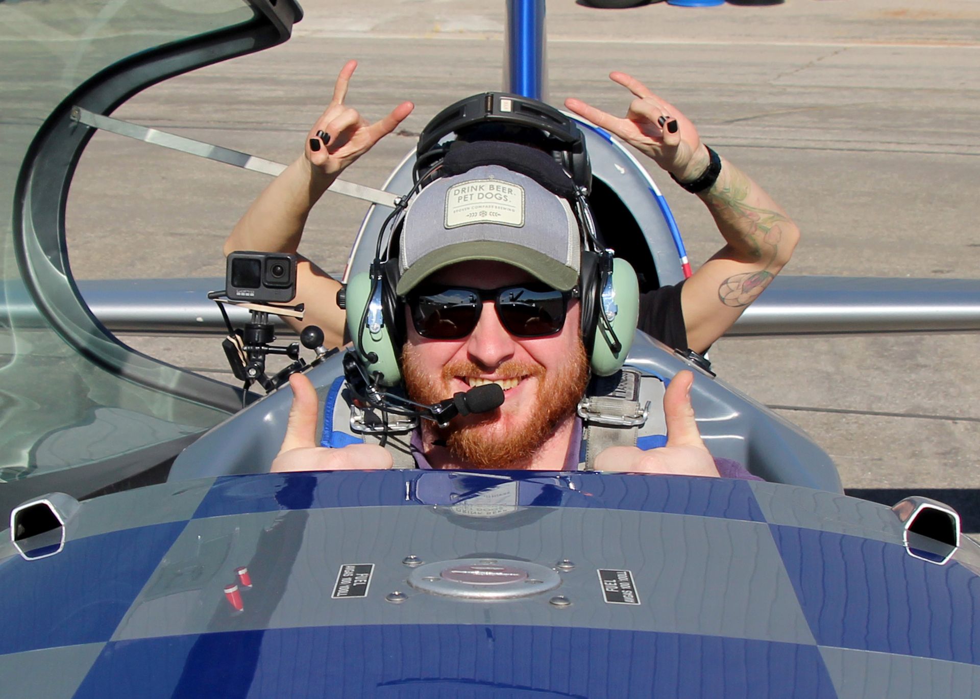 Getting strapped in to the Extra 330LC, the world's most advanced FAA certified stunt plane