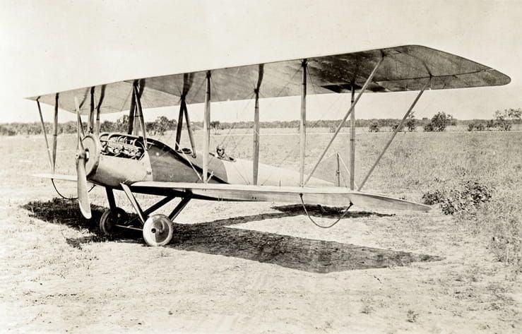 An historical photo of a biplane