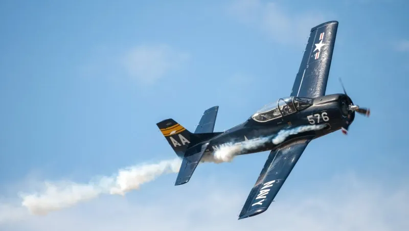 Stunt plane performing aerobatic move