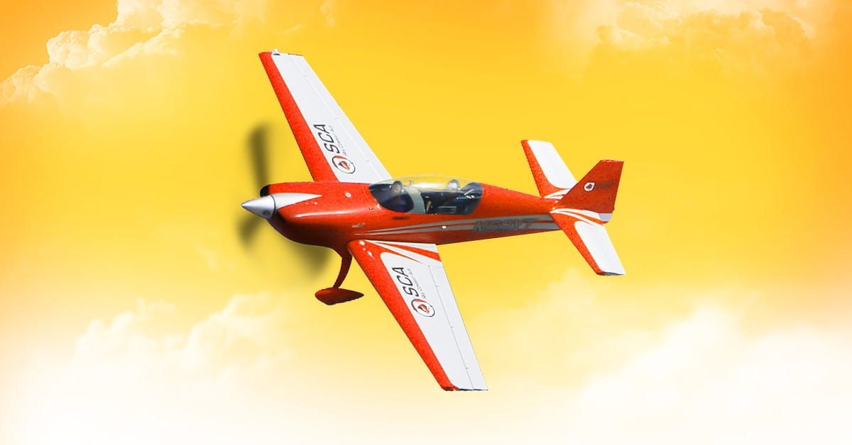 A red plane from Sky Combat Ace with a yellow sky in the background.