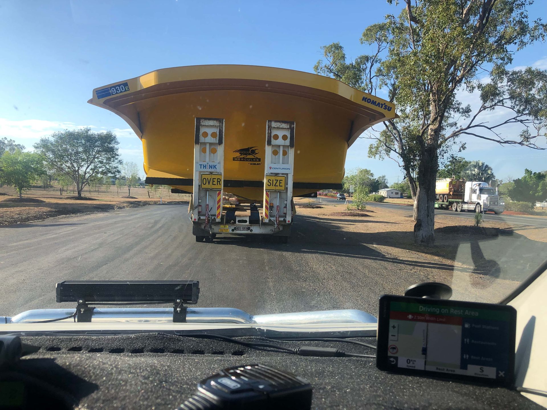 Driving Behind An Oversize Truck Hauling Mining Equipment — Col Adamson Transport Pilot Services In Farleigh, QLD