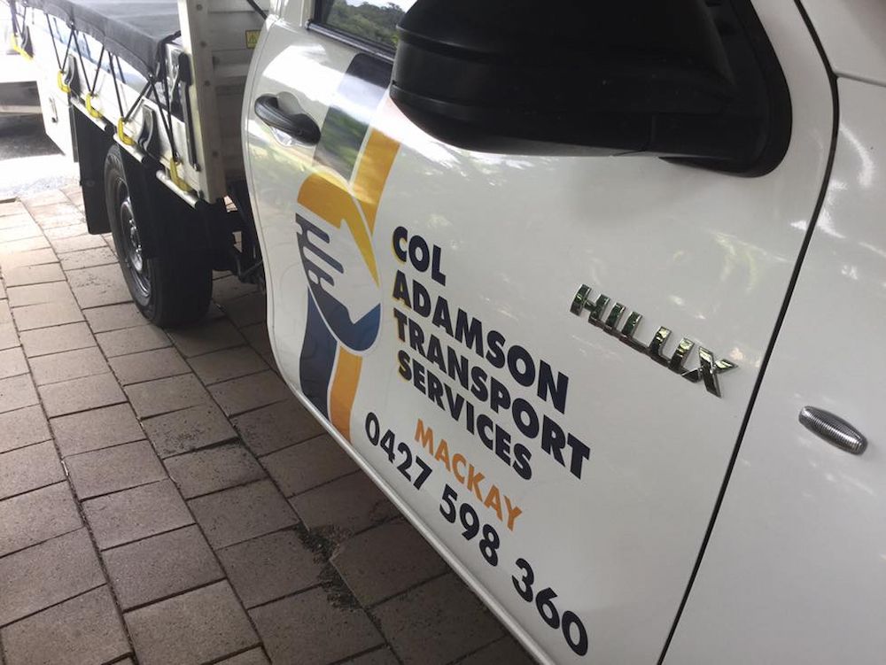 A White Hilux Truck From Col Adamson Transport Services — Col Adamson Transport Services in Farleigh, QLD