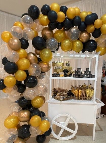 A dessert cart decorated for a graduation party in Hollywood, Florida.